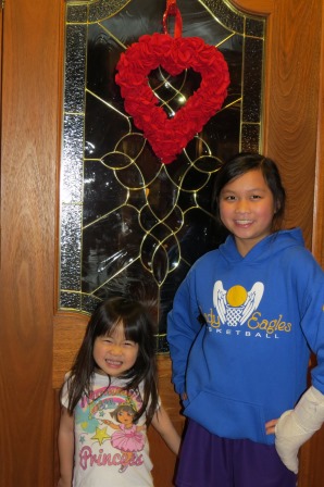 Kasen and Karis with their Valentine wreath
